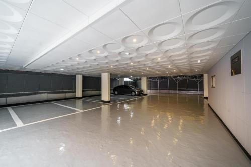a parking lot with a car parked in a parking garage at Hotel Rodem in Incheon