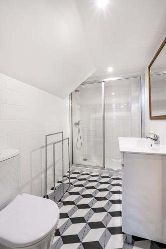 a bathroom with a shower and a toilet and a sink at VIVA Library Studio in Porto