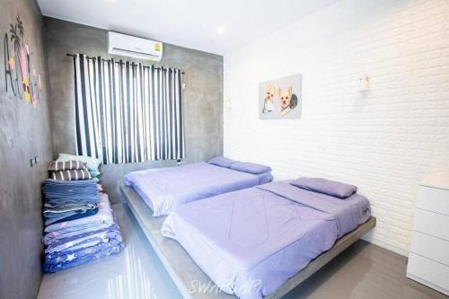 En eller flere senge i et værelse på Live@loft Pool Villa @ Huahin หัวหิน