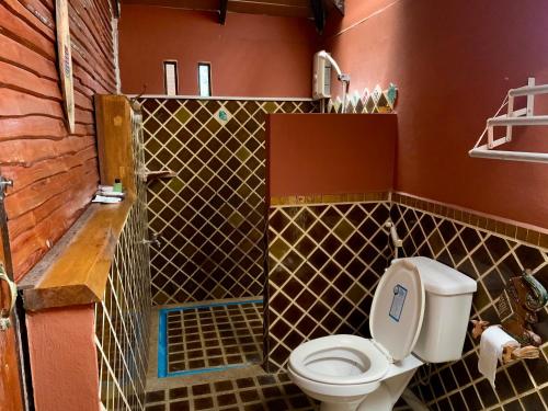 a bathroom with a toilet and a shower at ครัวพาร์3ริเวอร์ไซด์แอนด์รีสอร์ท 