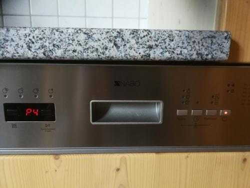 a microwave oven sitting on top of a kitchen counter at Appartement-Pension Familie Gewessler in Bad Mitterndorf