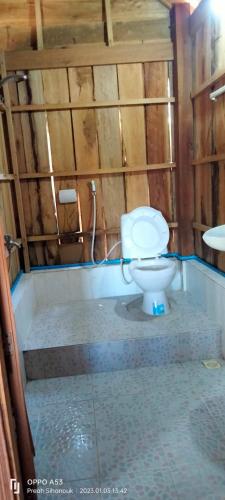a bathroom with a toilet and a sink at Sok Mean Bungalows in Koh Rong Sanloem