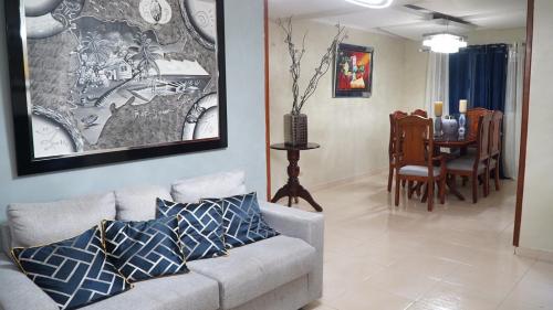 a living room with a couch and a dining room at BALCONYN 2 SEGURIDAD 24h in La Guáyiga