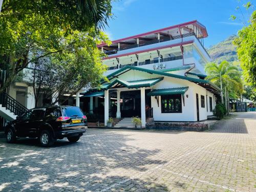 a car parked in front of a building at Ama Residence in Matale
