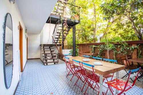 a patio with a wooden table and chairs at Mare Nostrum in Kas