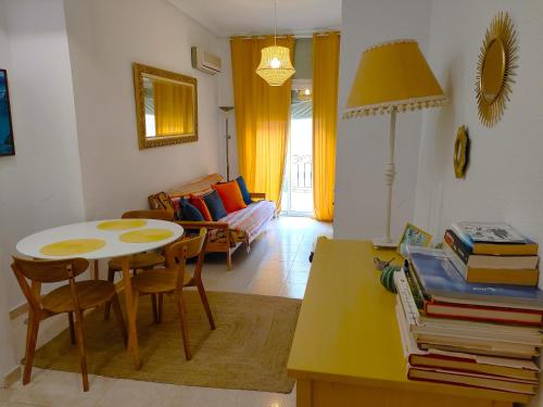 a living room with a table and a couch at Casco histórico in Alicante