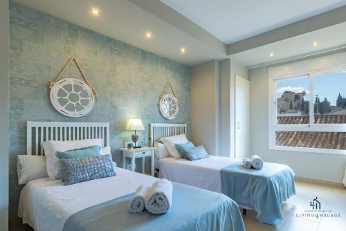 Posteľ alebo postele v izbe v ubytovaní Living4Malaga Picasso Deluxe Apartment