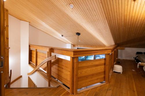 a wooden desk in a room with a ceiling at HolySuites 1 "Roggenecke" - Cosy Slope Side Apartment with Scenic Views in Pyhä Ski Resort in Pyhätunturi