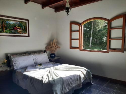 Postel nebo postele na pokoji v ubytování Fazendinha Paraíso