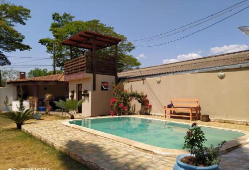 a pool in the backyard of a house at Pousada Flor da Chapada in Chapada dos Guimarães