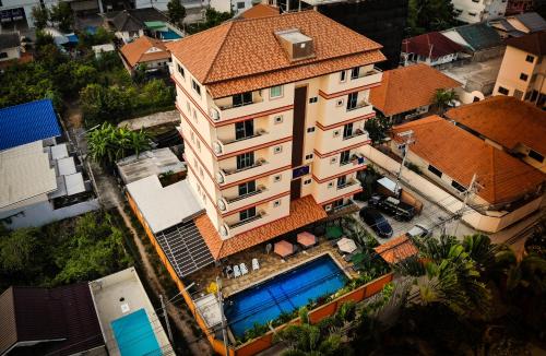 an overhead view of a building with a swimming pool at Sky Villa Hua Hin Guesthouse - Adults-Only in Hua Hin