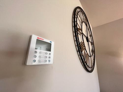 a clock hanging on a wall next to a room at Vera-Mojácar Valle del Este Resort Golf & SPA in Vera
