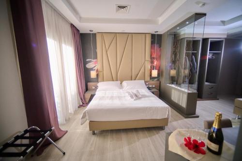 PARK HOTEL LE DUNE DI GIOVINOにあるベッド