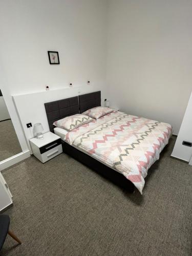 Postel nebo postele na pokoji v ubytování Apartman Infinity