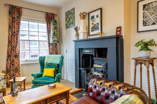 a living room with a couch and a fireplace at Apartment 4 - The Kings in York