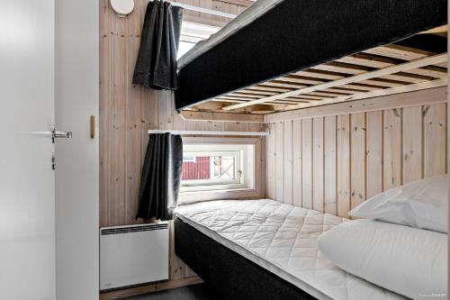 a bedroom with a bunk bed in a house at First Camp Skutberget-Karlstad in Karlstad