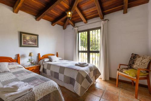 Postel nebo postele na pokoji v ubytování Los Algarrobos Gaucin