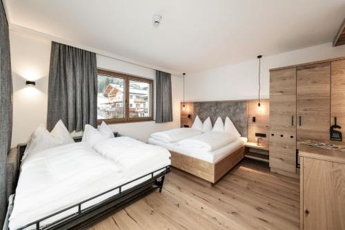 Postel nebo postele na pokoji v ubytování B&B Hotel Das Diellehen