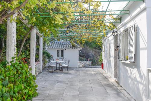 an outdoor patio with a table and a pergola at View Villas in Punta