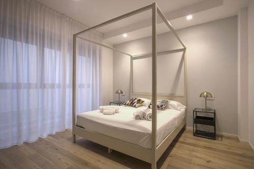 a bedroom with a canopy bed with a mirror at MILAN Luxury Suite-Hosted by Sweetstay in Milan