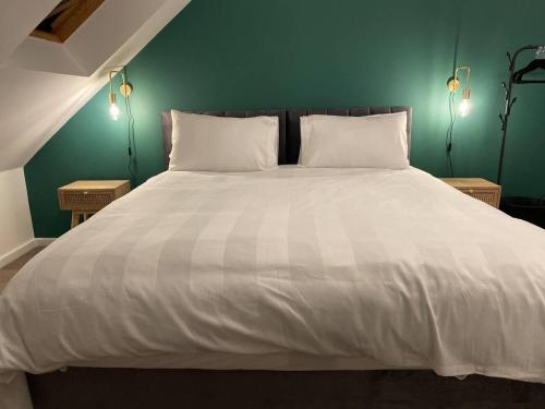 Postelja oz. postelje v sobi nastanitve Beautiful 4-Bed House in Lincoln- close to Centre