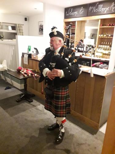 a man dressed in a kilt standing in a store at Nelthorpe Arms in Barton upon Humber