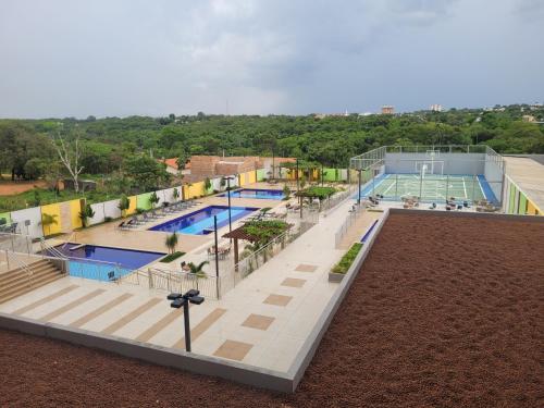 an overhead view of a swimming pool at a resort at CALDAS NOVAS - RECANTO DO BOSQUE Flat Service AP209 in Caldas Novas
