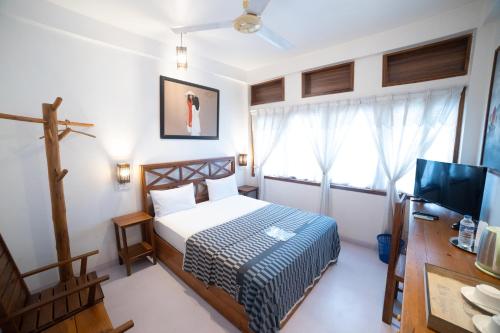 Ein Bett oder Betten in einem Zimmer der Unterkunft Cottage 2010