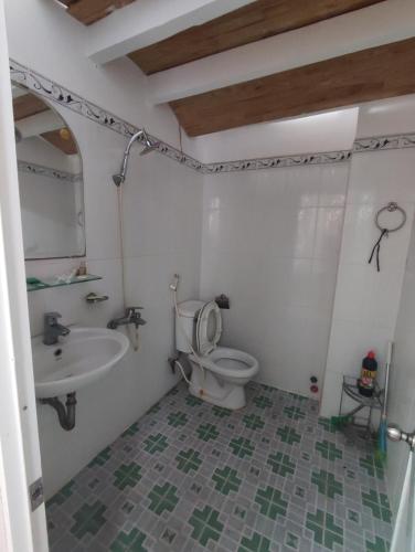 a bathroom with a toilet and a sink at Homestay 846/B53 in Vung Tau