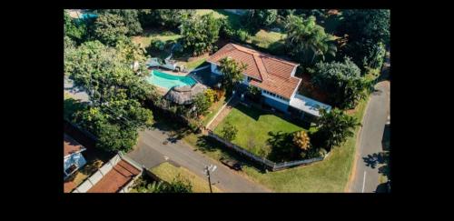an overhead view of a house with a swimming pool at Rose Holiday Home in Durban
