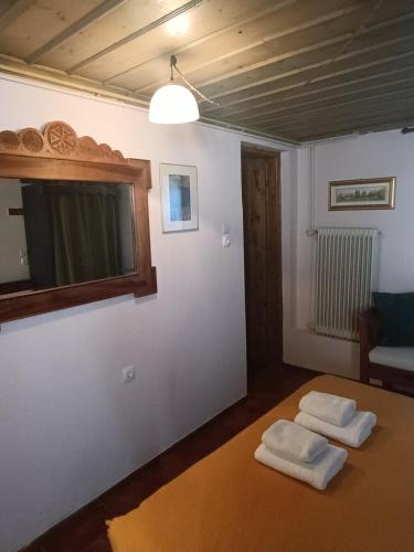 a living room with two towels on a table at Orestis House in Ano Pedina