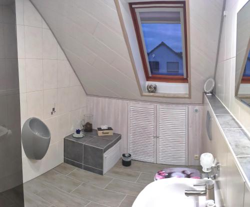 a bathroom with a sink and a window at Mones Monteur- und Ferienwohnung in Klötze