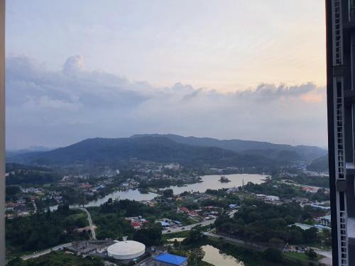 a view of a city with a river and mountains at New Modern Condo with Pool at Bangi in Kampong Tangkas