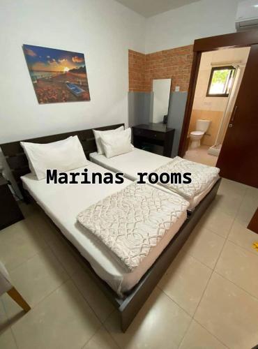 a bedroom with a large bed in a room at Marina's Rooms in Larnaka