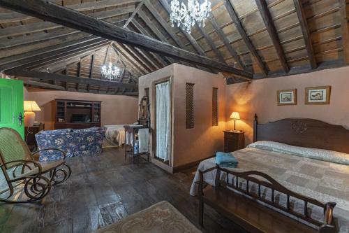 Postel nebo postele na pokoji v ubytování Casa Rural La Capellania