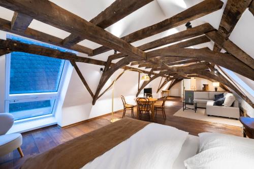 a bedroom with a bed and a living room at Goldener Löwe in Limburg an der Lahn