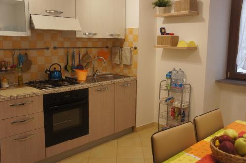a kitchen with a sink and a stove at BlueMind in Tropea