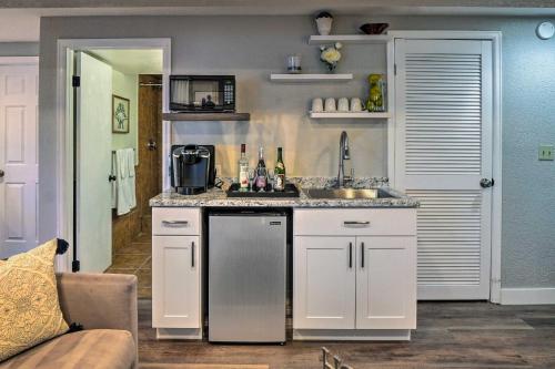 a kitchen with white cabinets and a sink at 6 Mi to Dtwn Parker Serene Studio Suite! in Parker