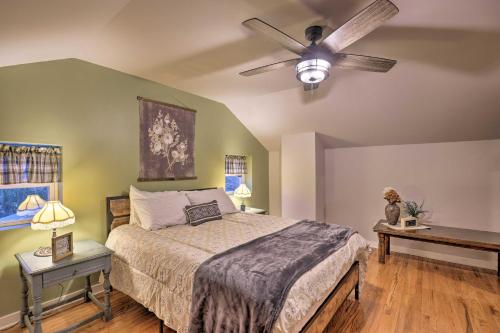 1 dormitorio con 1 cama y ventilador de techo en Pet-Friendly Seneca Lake Home with Private Deck, en Ovid