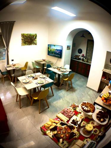 a restaurant with tables and chairs with food on them at Il vecchio Fauno in Pompei