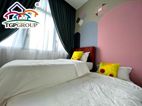 a bedroom with two beds and a large window at D'Pristine Design Apartment by TGP in Nusajaya