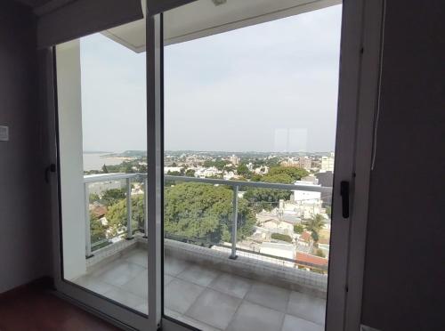 an open door to a balcony with a view at Gaudium in Paraná