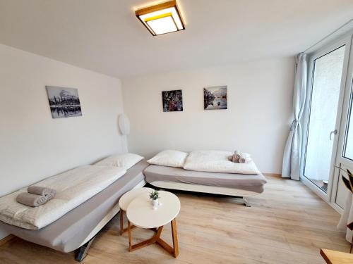 Postel nebo postele na pokoji v ubytování Schmidis Ferienwohnung Sonthofen