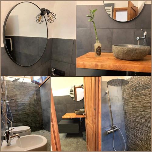 a bathroom with a mirror and a sink at Chalet Sweet Mountain in Ponte di Legno