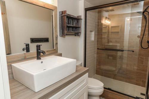 a bathroom with a sink and a toilet and a shower at Seven Springs 2 Bedroom Premium Condo, Great for families condo in Champion