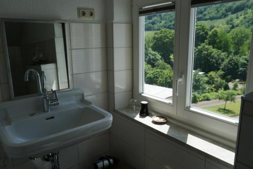 a bathroom with a sink and a window at Apartment Lollo in Enkirch