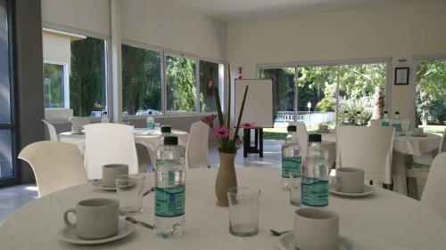 a white table with bottles of water on it at VILLAGE PARK in Tandil