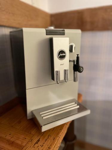 a white coffee machine sitting on top of a table at Weberhof - Münster 3 in Münster