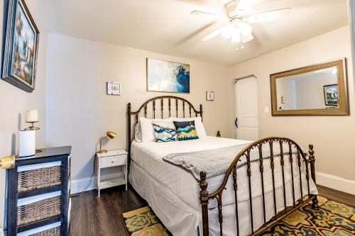 a bedroom with a bed and a ceiling fan at Relaxed Asheville Apartment - Pet-Friendly in Asheville