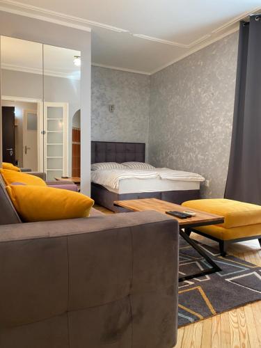 a living room with a bed and a couch at Dragon in Belgrade